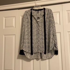 Black and white and red dots , black ribbon around neck to be tied into bow